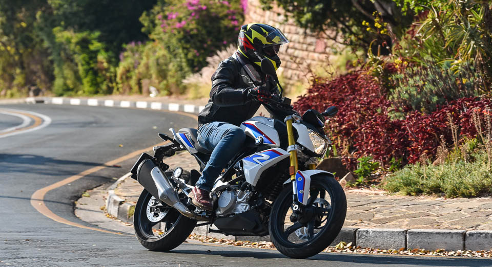 Solo rider in suburbia on the G 310 R