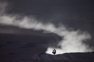 A BMW GS leaves a trail of dust behind it.