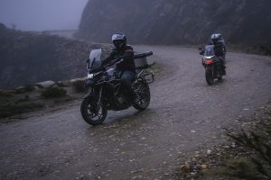 Zontes 310T motorcycles on a dark and misty Swartberg pass