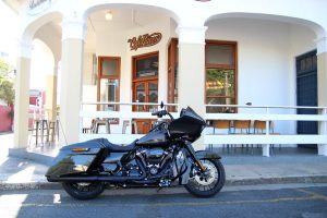 A Harley-Davidson Road Glide Special parked at a café in the Strand